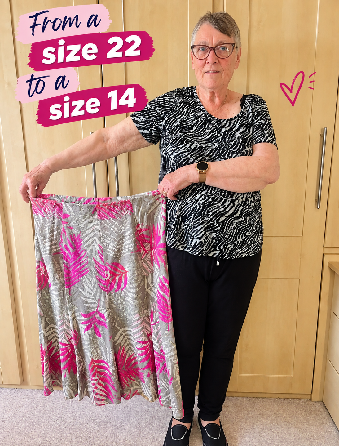 Sue Chapman in her kitchen holding out the floral skirt she wore before her lifestyle change, now far too large for her.